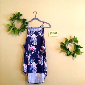 Silky feel. Never worn. Drop tank in length. Slight halter fit.